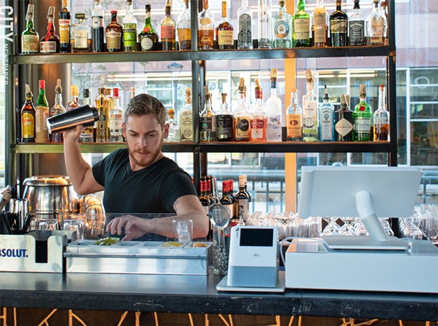 Adam tends the bar at VOLO. - PHOTO BY JACOB WALSH