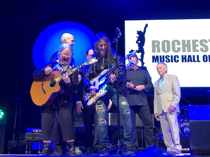Christine Lavin (front left) performing at the 2019 Rochester Music Hall of Fame Induction Ceremony last April with Ron “Bumblefoot” Thal (front right) and Al Jardine (far right). - PHOTO BY PETER PARTS