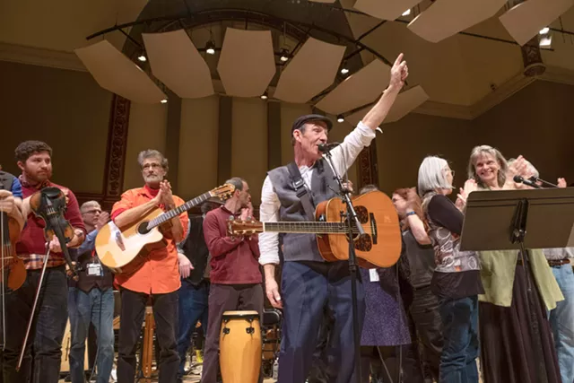 John Dady (foreground) leads the musicians at Hochstein Performance Hall in a concert tribute to his brother, the late Joe Dady. - PHOTO BY JULIE GELFAND