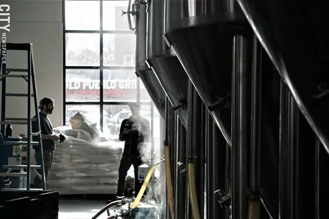 Steam rises from kettles at Three Heads Brewing on Thursday, Jan. 30. The brewery was producing a new batch of The Kind IPA, Three Heads' best selling beer. - PHOTO BY GINO FANELLI