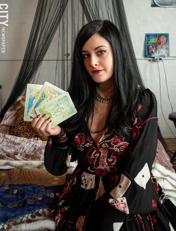 “It helps you have a conversation with yourself, but you’re outside yourself,” Fayebriel Barrette says of tarot. “So instead of bouncing these ideas off your partner, if you don’t have one, your tarot deck can be like your companion.” - PHOTO BY JACOB WALSH