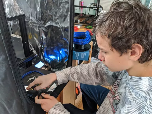 David Gerard works on a 3D printed headband for a face shield. - PHOTO PROVIDED