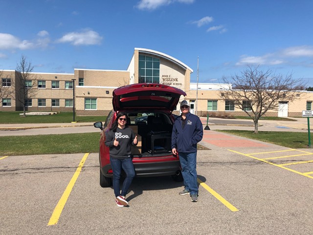 Bill Ottman, Webster Central School District's director of science and technology, met Coty Pastene in a parking lot to hand off a 3D printer owned by the district and a supply of filament for it. - PHOTO PROVIDED