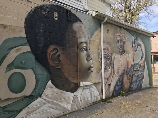 A mural on the exterior back wall of NEAD (North East Area Development) offices. - PHOTO BY DAVID ANDREATTA