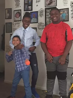 Porter's three sons pose for a group photo. - PHOTO PROVIDED