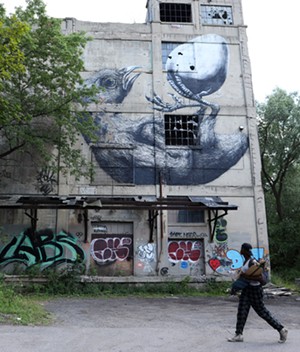 A former Vacuum Oil building sits vacant along the Genesee River at 5 Flint Street. - PHOTO BY MAX SCHULTE