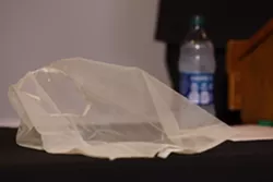 Michael Mazzeo, Rochester police union president, displayed a spit sock for reporters and explained why officers would use it. - PHOTO BY MAX SCHULTE