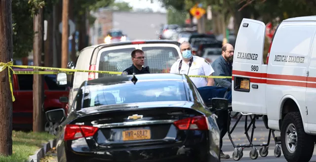The Monroe County Medical Examiner took custody of two bodies from the backyard of 278 Pennsylvania Ave. after a mass shooting took place. - PHOTO BY MAX SCHULTE