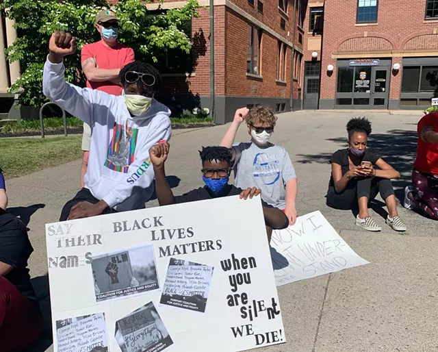 Students rally outside the Fairport Village Hall and Police Department in June 2020. - PHOTO BY ALEXA GUZMÁN
