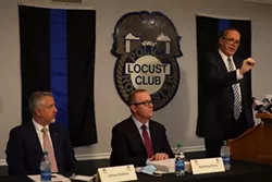 Michael Schiano, flanked by James Nobles (left) and Matthew Rich, said the officers he and the other attorneys represent are being treated unfairly. - PHOTO BY MAX SCHULTE