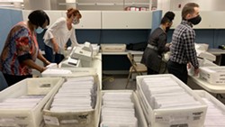Board of Elections workers began counting ballots at 10 a.m. on Monday, Nov. 16. - PHOTO BY JEREMY MOULE