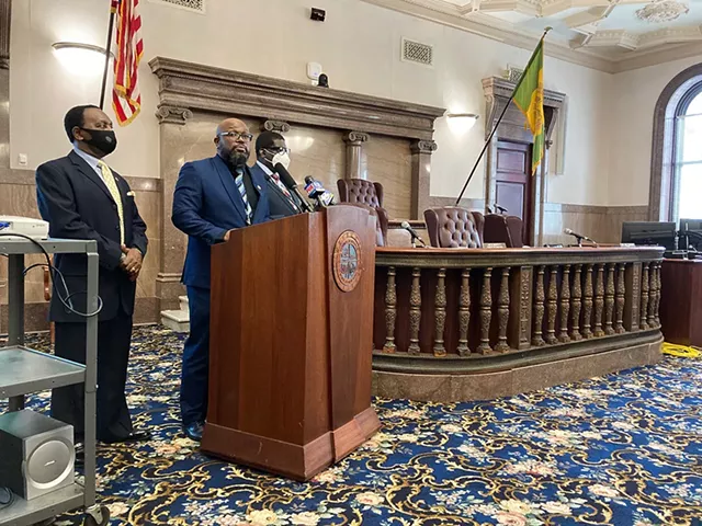 Legislator Ernest Flagler-Mitchell, leader of the county Legislature's Black and Asian Democratic Caucus, flanked by Legislator Calvin Lee, left, and Legislator Vince Felder, right. - PHOTO BY JEREMY MOULE