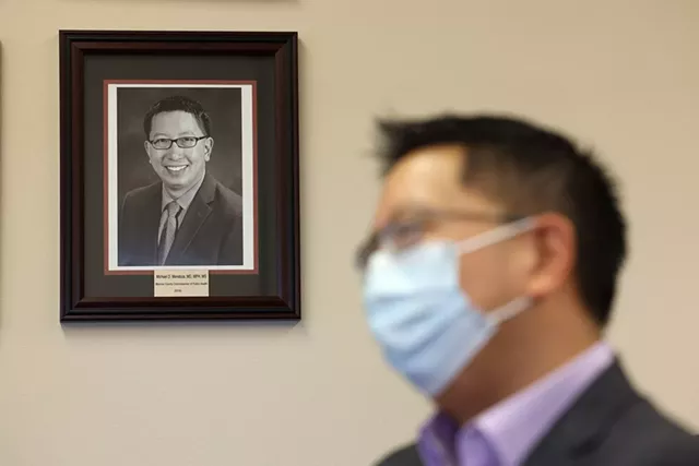 Monroe County Public Health Commissioner Dr. Michael Mendoza speaks from a conference room near his office at the county Health Department. - PHOTO BY MAX SCHULTE