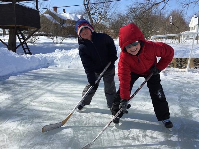 Lucas and Owen Andreatta on the Andreatta backyard rink in Fairport. - PHOTO BY DAVID ANDREATTA