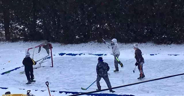 Children play hockey on the Vadney family backyard rink in Perinton. - PHOTO COURTESY OF SCOTT VADNEY