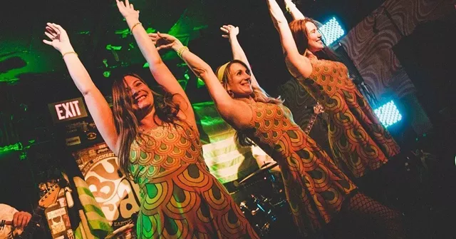 Dancers performing with the local surf band The Isotopes during a Bug Jar show. - PHOTO BY BRIAN FERGUSON