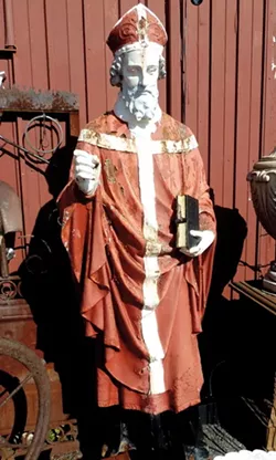 The statue of St. Boniface was painted red when it was discovered in an antique shop in Avon, Livingston County, prior to its return to St. Boniface Catholic Church in Rochester. - PHOTO PROVIDED BY JOSEPH PASQUARELLI