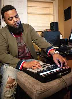 Demetriuse Smith, aka Cello Brown, in his home studio in Irondequoit. - PHOTO BY JACOB WALSH