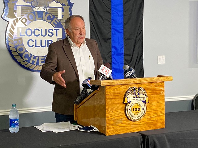 Rochester Police Locust Club President Michael Mazzeo speaks from a podium at the union's headquarters. - FILE PHOTO