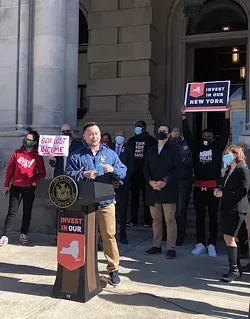 Assemlbyman Ron Kim, D- Queens spoke at a rally to celebrate the inclusion of new taxes on the wealthy and increased school funding in the state budget, at a rally outside the State Capitol on April 7, 2021 - PHOTO BY KAREN DEWITT