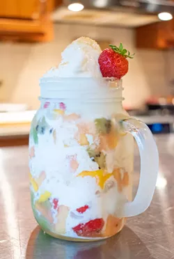 Cap the meal with a decadent version of a parfait made with coconut gelato and tropical fruit. - PHOTO BY JACOB WALSH