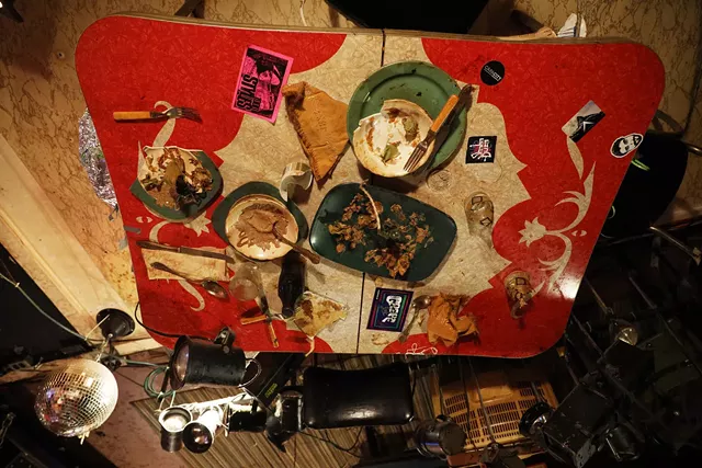 A messy table, one of the many items bolted to the Bug Jar's ceiling. - PHOTO BY MAX SCHULTE / WXXI NEWS