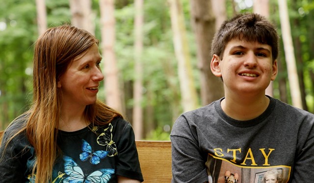 Catherine Abida and her son, Ali, at the Autism Nature Trail in Letchworth State Park. Ali was one of the inspirations for the trail after a conversation between Loren Penman and Pat Strobel, Ali's grandmother. - PHOTO BY MAX SCHULTE
