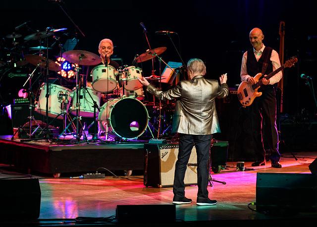 Tony Levin, with drummer Steve Gadd and Paul Simon on vocals, at the Rochester Music Hall of Fame concert on Apr. 22, 2018, in Kodak Hall at Eastman Theatre. - PHOTO BY JIM DOLAN