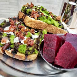 Open Face's Mashed Pea sandwich is served hot and open with melted Gorgonzola, balsamic glaze, and crumbly bacon. - PHOTO PROVIDED