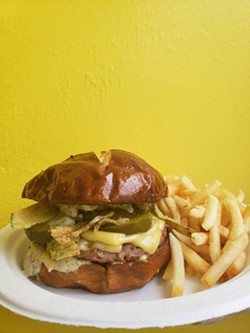 The Dilly Burger is on the menu at Misfit Treats and Eats, which recently expanded its vegan menu beyond doughuts to include savory dishes. - PHOTO PROVIDED