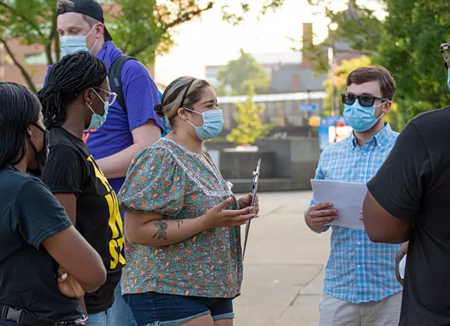 Working Families Party of Rochester Chairperson Stevie Vargas speaks with canvassers. - PHOTO BY JACOB WALSH