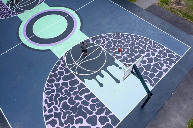 The basketball court at Marktetview Lodge was the first city court to received a fresh coat of paint courtesy of Peculiar Asphalt, a city-run program that brings Rochester residents, ages 16 to 20, together to design and paint murals on city basketball courts. - PHOTO BY NATE MILLER
