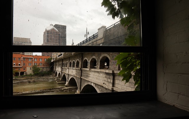 The Broad Street bridge and aqueduct, as seen from a window inside of the Aqueduct building. The city plans to remove the bridge to expose the historic Erie Canal aqueduct beneath and potentially rewater it. - PHOTO BY MAX SCHULTE