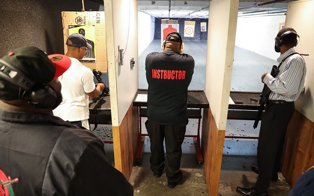 Members of the Rochester African American Firearms Association shoot targets at The Firing Pin. - PHOTO BY MAX SCHULTE