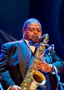 Legendary saxophonist-composer-arranger Pee Wee Ellis performing at the 2016 Rochester Music Hall of Fame induction ceremony. - PHOTO BY JIM DOLAN