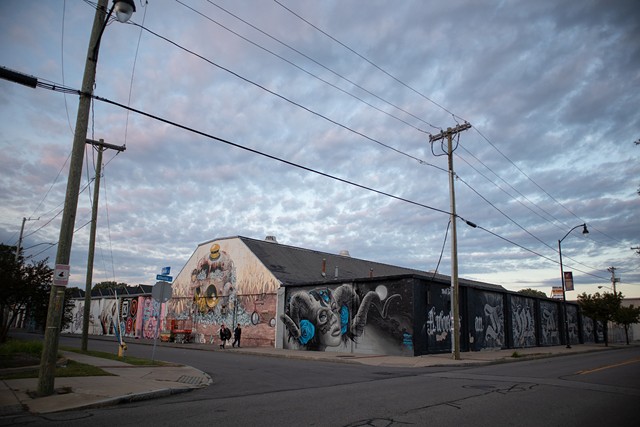 Murals installed by WallTherapy over the past decade cover the walls of a warehouse complex at Greenleaf Street and Atlantic Avenue. - PHOTO BY QUAJAY DONNELL