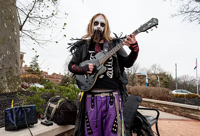 A native of Bergen, Sprague travels around the region, from Genesee County to the city of Rochester, jamming on his guitar. - PHOTO BY JACOB WALSH
