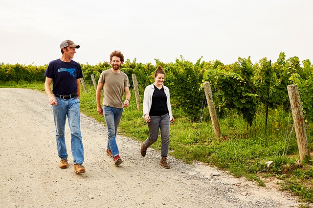 Fred Merwarth, left, Wine Enthusiast magazine's "Winemaker of the Year," tours the Herman J. Wiemer vineyard with winemaker Dillon Buckley and assistant winemaker Bryanna Cramer. - PHOTO PROVIDED