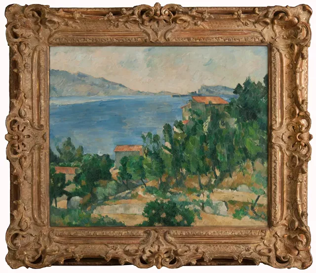 Cezanne's "View of Mt. Marseilleveyre and the Isle of Maire" before (top) in an 18th-century Revival style frame, and after in a replica 19th-century Louis XV gilded Revival frame hand-carved by Paul Mitchell, of London. The reframing project cost $7,500.