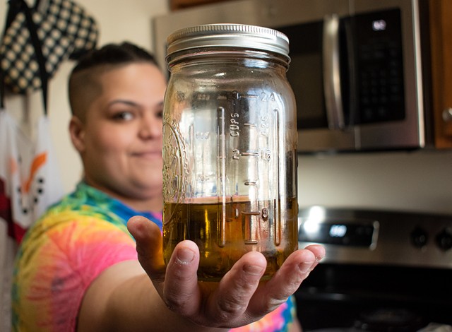 Edibles maker Adriana Quinones makes her own cannabis-infused cooking oils, which she uses in her recipes. - PHOTO BY JACOB WALSH