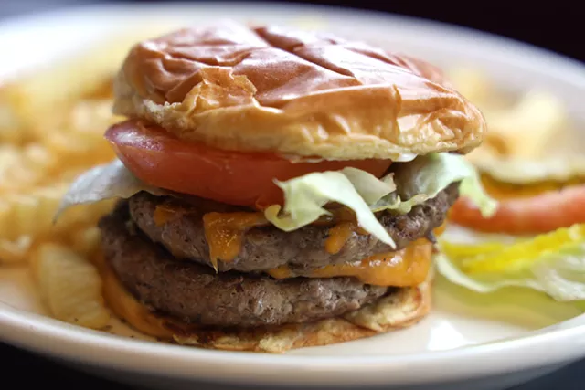 The Royal Cheddar Burger at Queen J's Diner comes with two juicy patties for $8. - PHOTO BY MAX SCHULTE