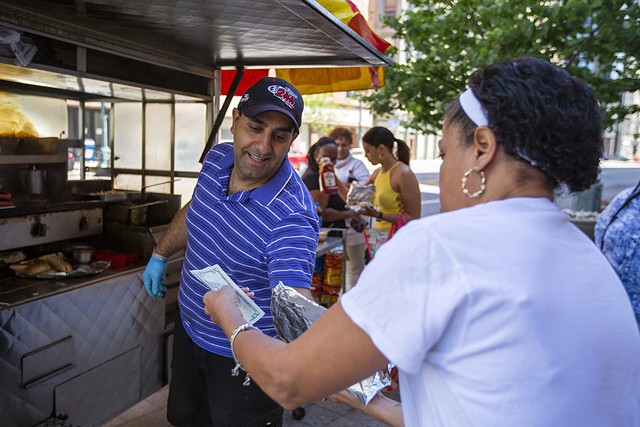 Charlie Abiad, who is a regular outside of the Monroe County Office Building, is the last hot dog vendor standing on Main Street in downtown Rochester. When he opened his stand in 2001, there were sometimes two vendors per block. - PHOTO BY LAUREN PETRACCA