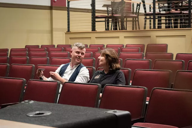 Fletcher and Ann Younger sit in the renovated Avon Park Theater. - PHOTO BY JACOB WALSH