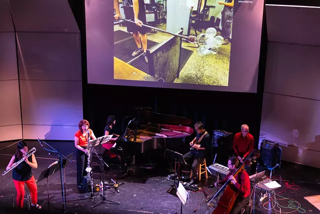 The members of fivebyfive perform at The Theater at Innovation Square while More Fire Glass Studio creates a glass sculpture remotely. - PHOTO BY MATT BURKHARTT