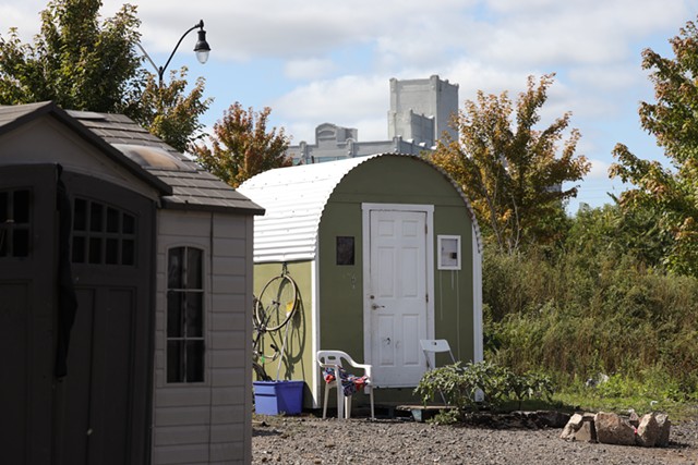 Peace Village, a homeless camp on Industrial Street, is made up of a handful of prefabricated sheds and wooden huts. - PHOTO BY MAX SCHULTE