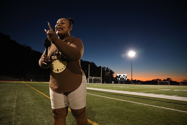 Karen Iglesia films a halftime show during a break in the action of a soccer game at Sutherland High School in Pittsford. - PHOTO BY MAX SCHULTE