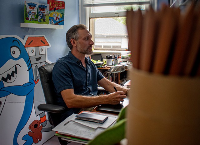 Children's book author and artist Brian Yanish works in his home office in Rochester. - PHOTO BY JACOB WALSH