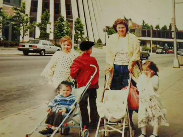 Chef Wilfredo Arguinzoni, in the stroller, walks in downtown Rochester with his mother and siblings once upon a time. - PHOTO PROVIDED BY WILFREDO ARGUINZONI