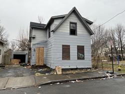 The city has asked a court for permission to demolish this vacant house on Riley Park. - PHOTO BY JEREMY MOULE
