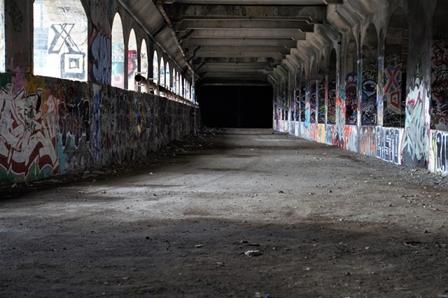 The aqueduct bed sits dormant, save its life as a canvas for graffiti artists. - PHOTO BY MAX SCHULTE